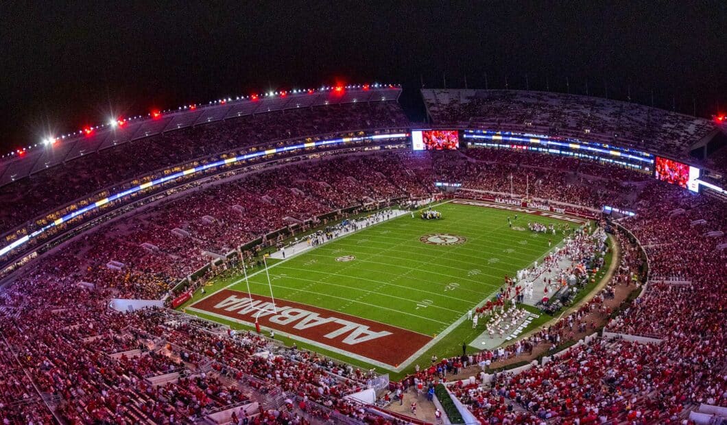 Bryant-Denny Stadium glowing red at night